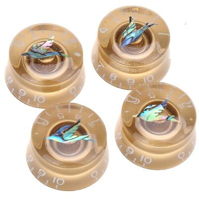 1 BOUTON LOUPE METRIQUE DORE AVEC MOTIF OISEAU ABALONE